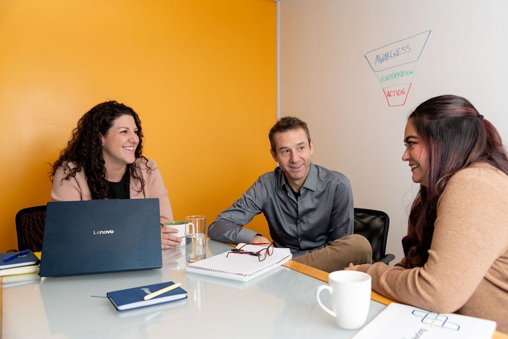 A senior marketing leader in the room, in a working session with the client team